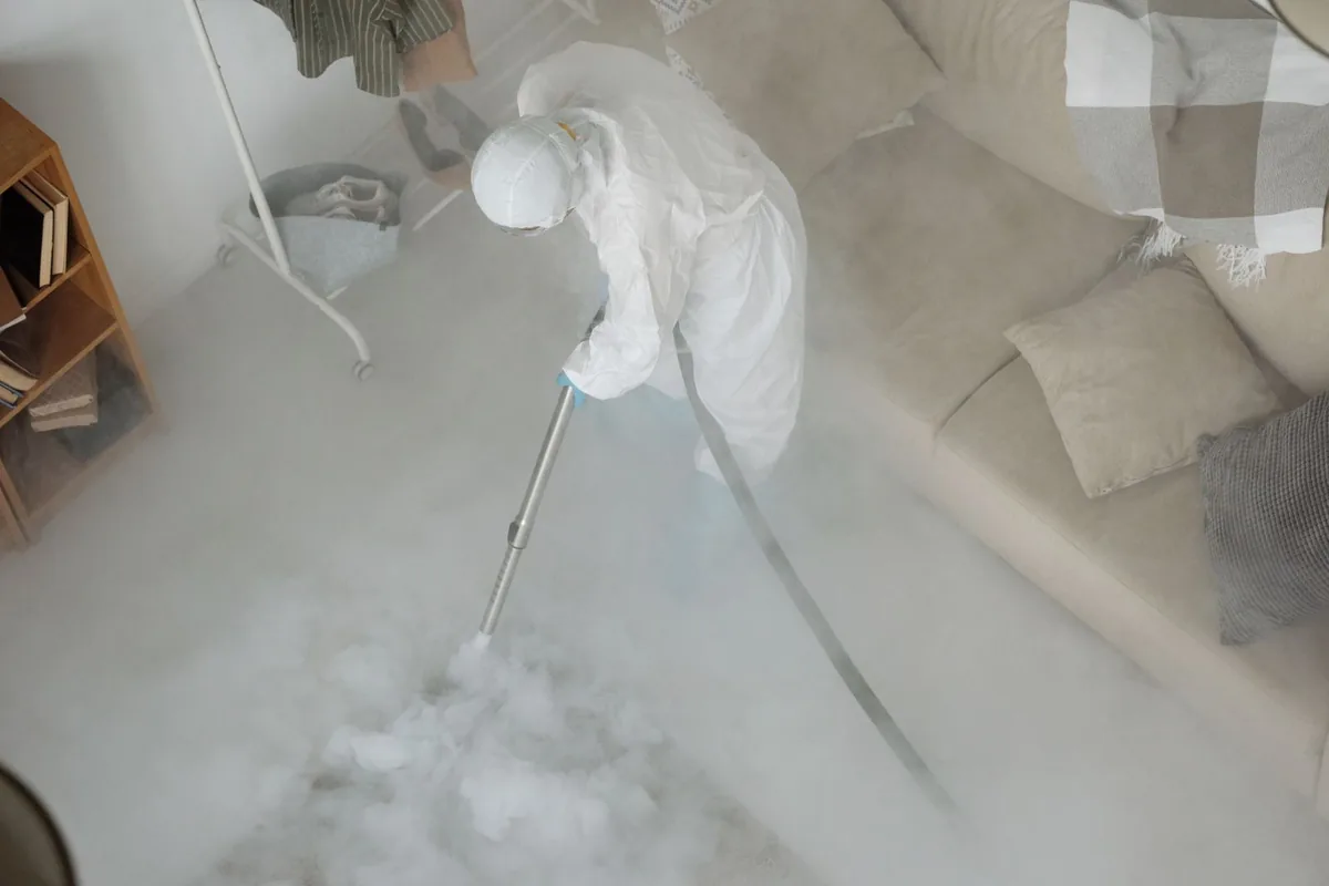 Biohazard cleanup technician in protective equipment, Claiborne, LA